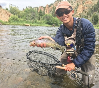 Andrew Dang of Rutgers University poses with a nice trout.