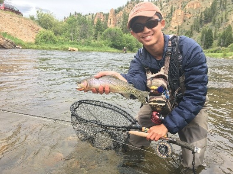 Andrew Dang of Rutgers University poses with a nice trout.