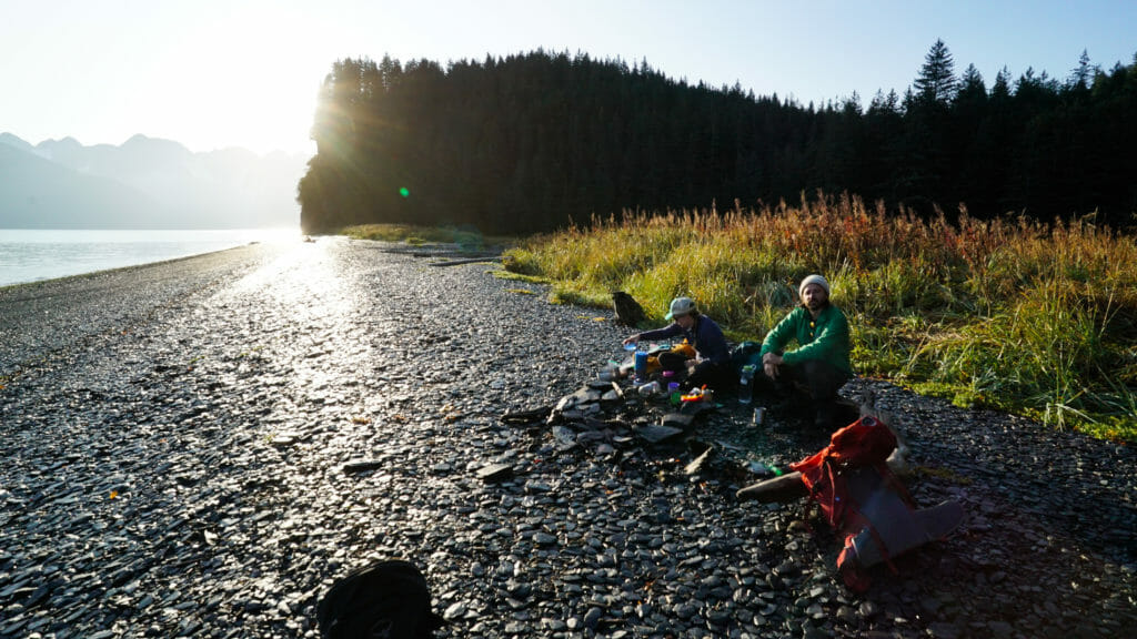 Hikers enjoy sunrise on Resurrection Bay, Alaska.