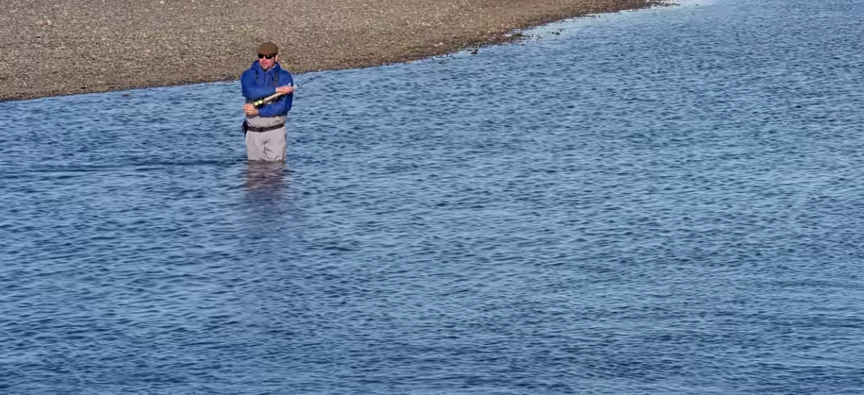 An angler fishes for sea-run brown trout on Tierra del Fuego's Rio Grande River.