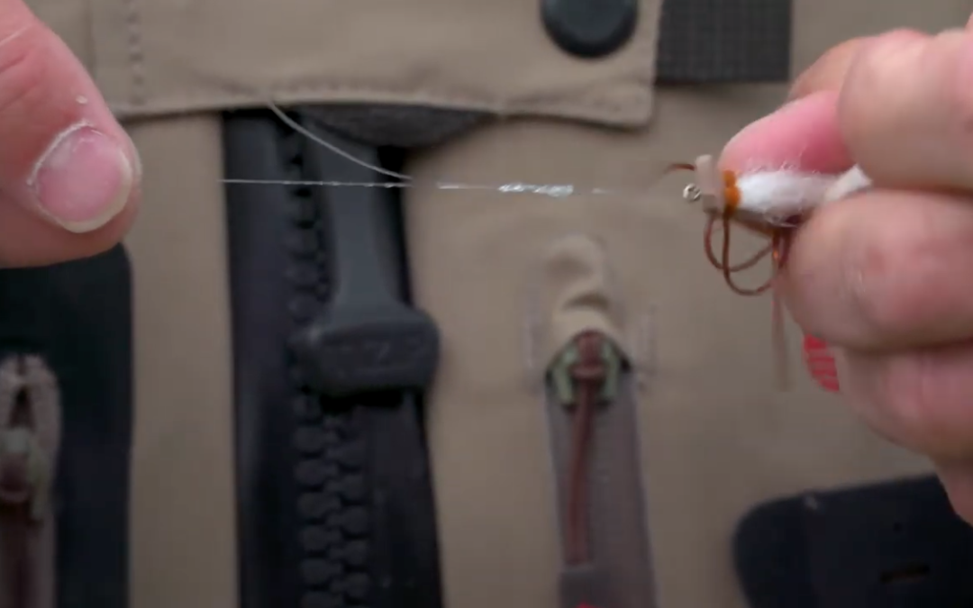 Twist the fly when tightening