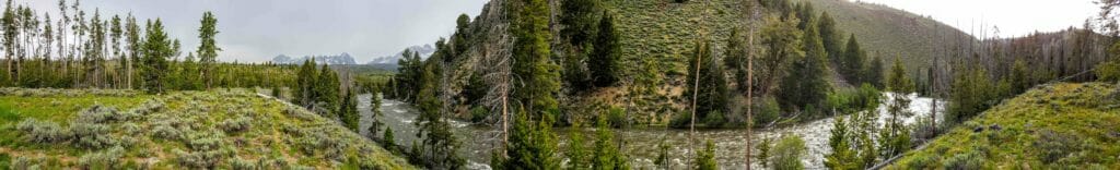 The Salmon River flows beneath the Sawtooth Mountains of central Idaho.