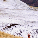 Hunters hike steep mountain slopes in search of chukar.