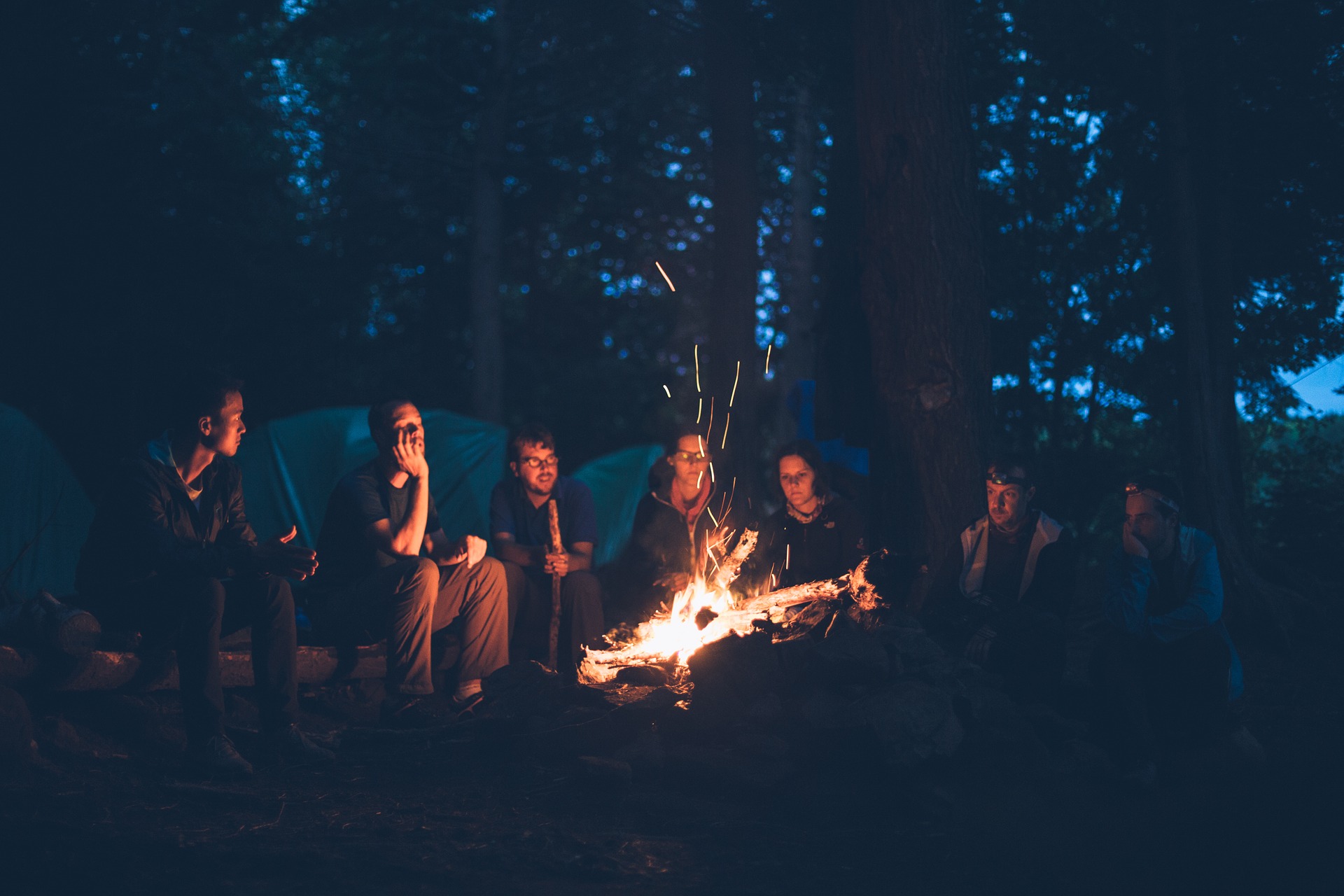 A group of people gathered around a campfire
