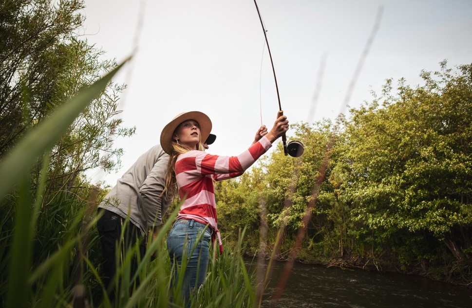 A picture containing outdoor, sport, fishing, holding
Description automatically generated