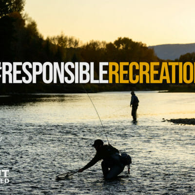 A meme showing two anglers practicing social distancing