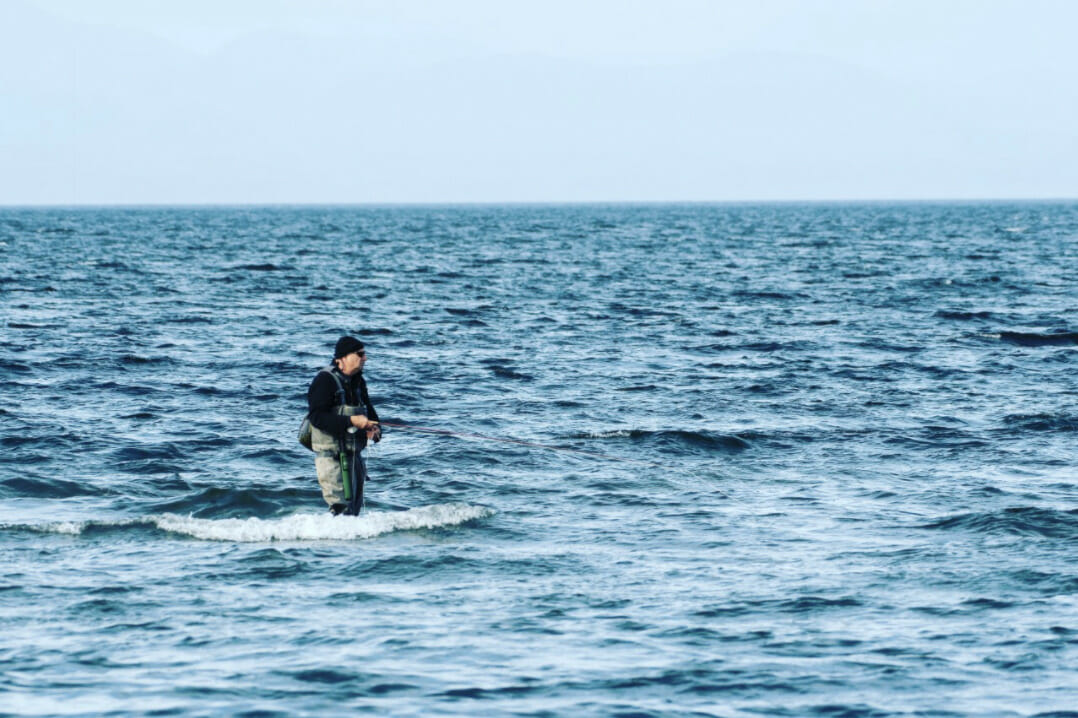 An angler fishes the salt off of Vancouver Island.