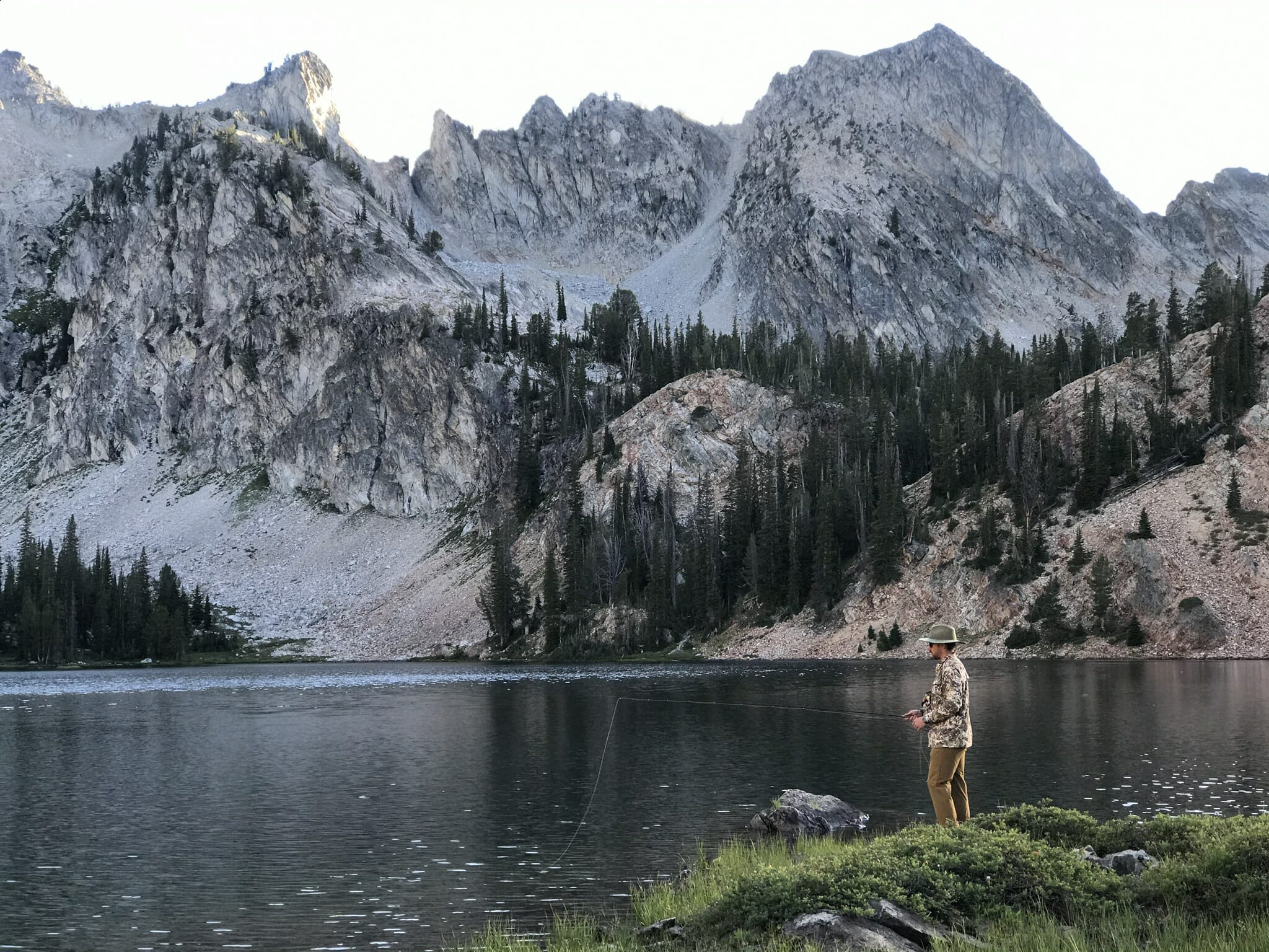 Casting for trout in a mountain lake.