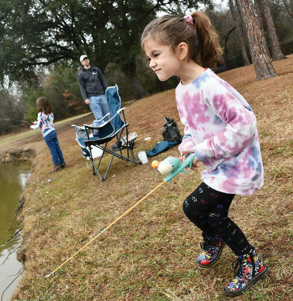 The author's daughter, Daphne, waits for a fish.