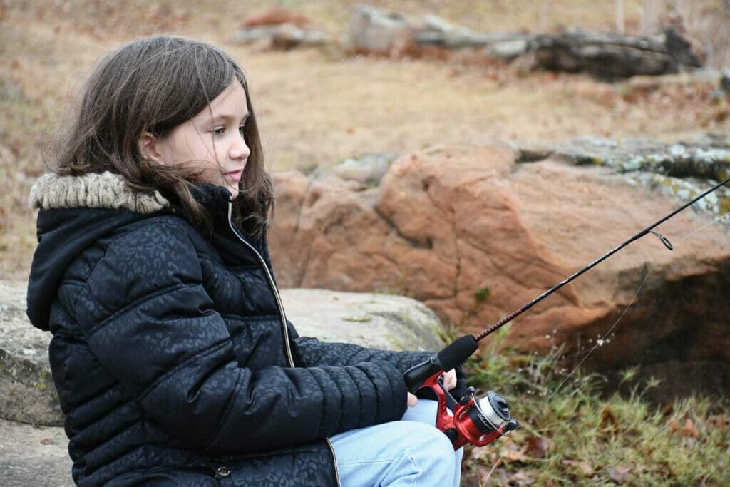 The author's daughter, Penelope, fishes