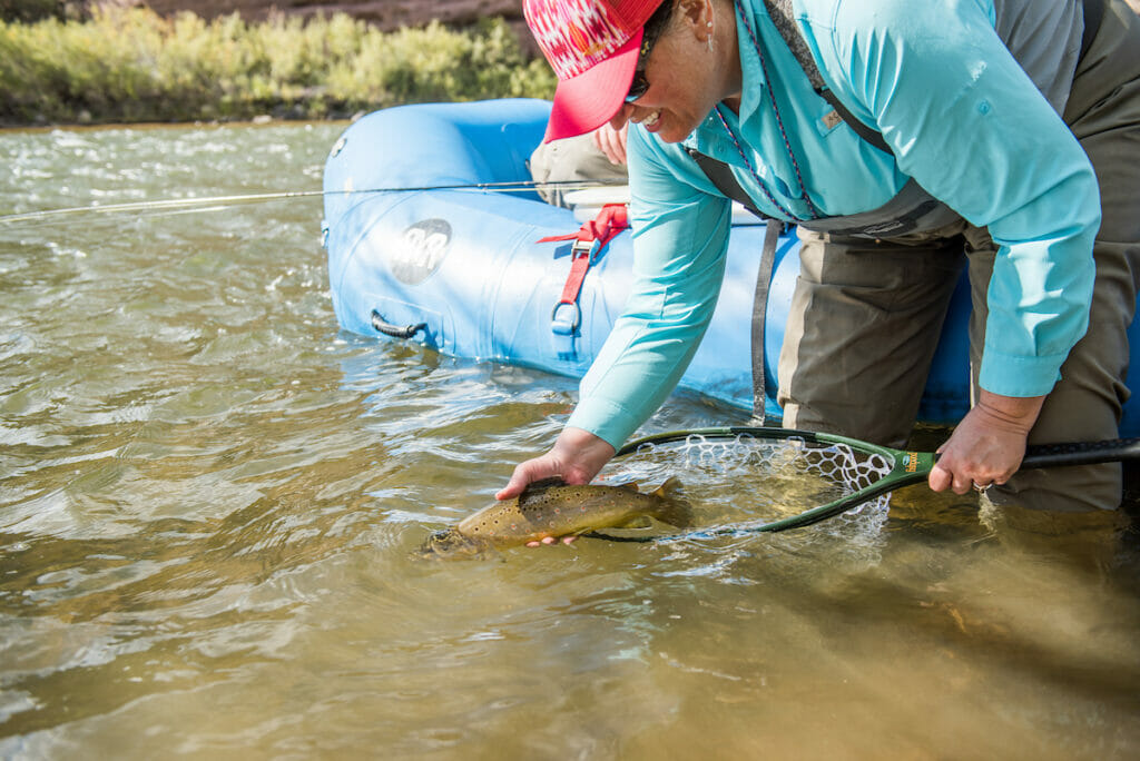 Woman catches and releases trout back into river