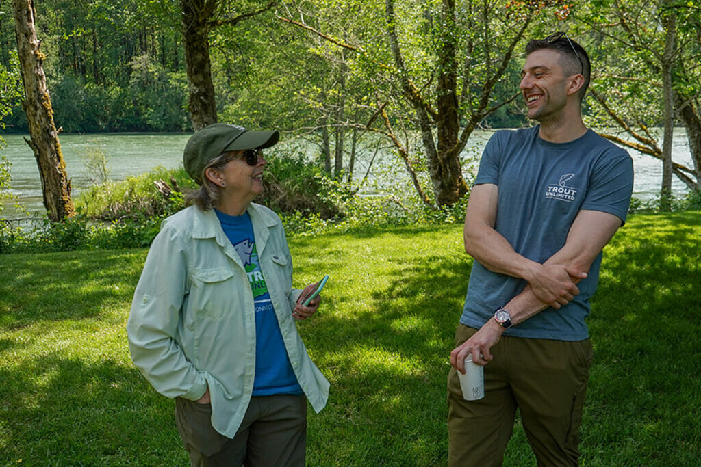 Man and woman smile during a conversation