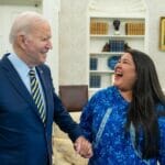 President Joe Biden and Alannah Hurley laugh together in the oval office