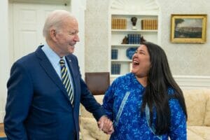 President Joe Biden and Alannah Hurley laugh together in the oval office