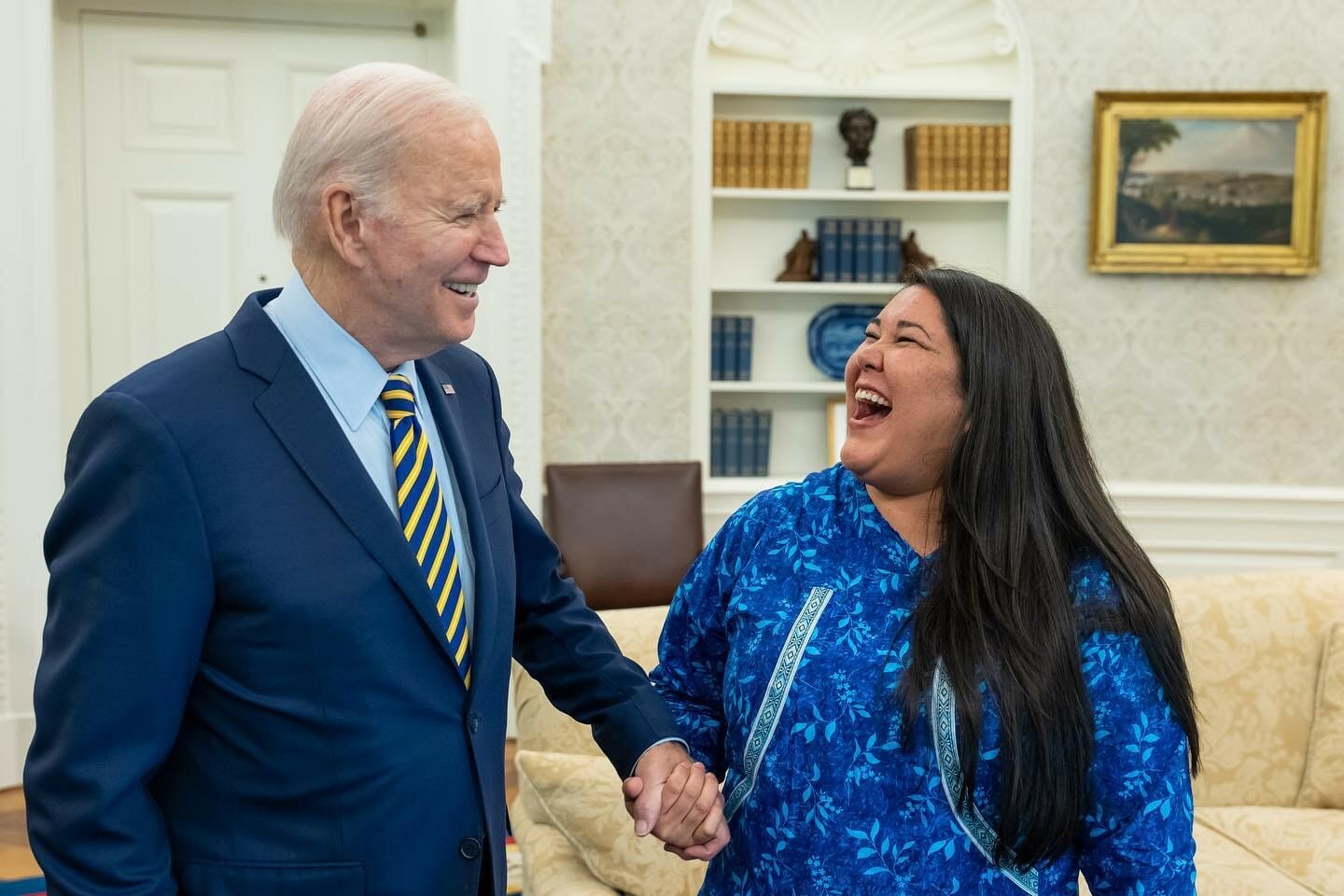 President Joe Biden and Alannah Hurley laugh together in the oval office