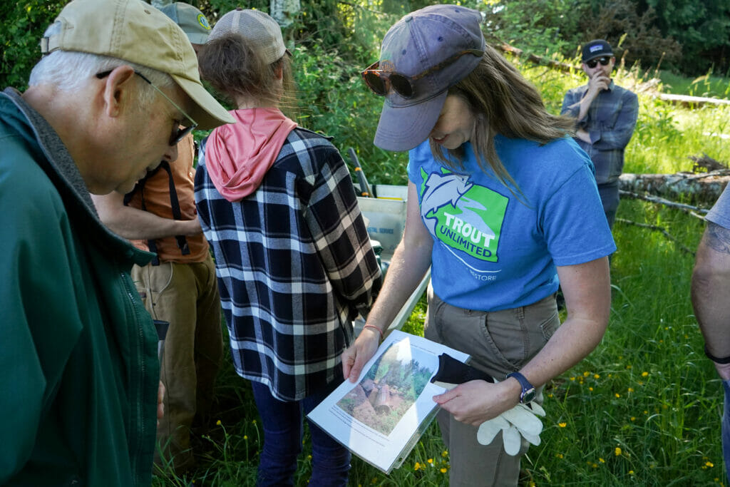 Woman showing a man a print out picture