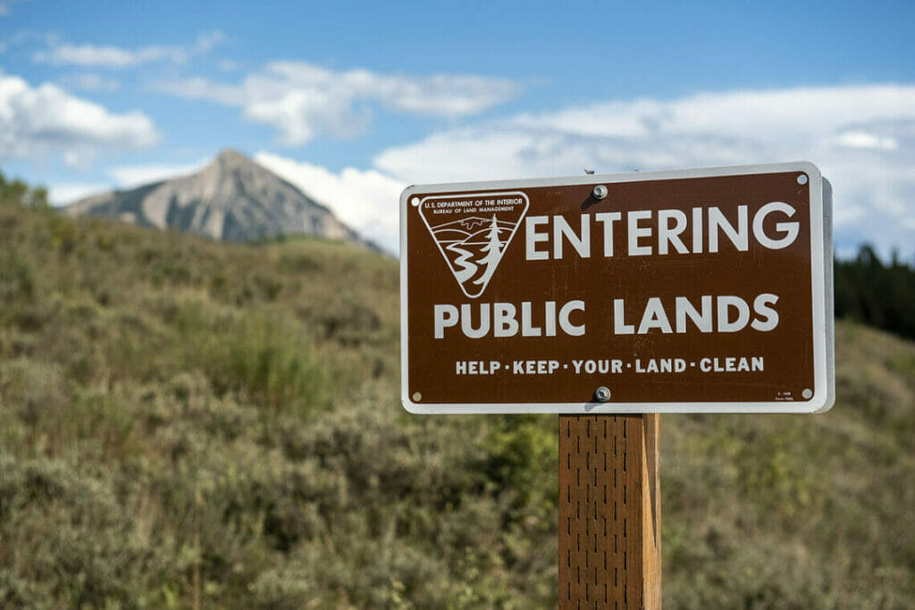 Sign reading "Entering Public Lands. Help keep your land clean"