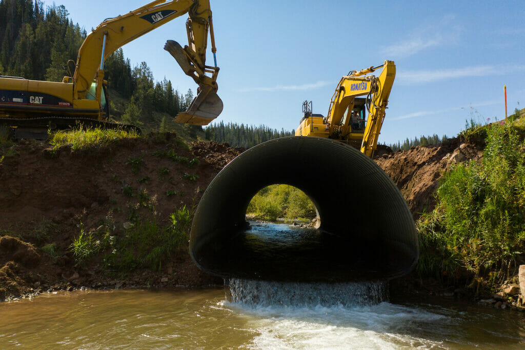 Two backhoes and a culvert