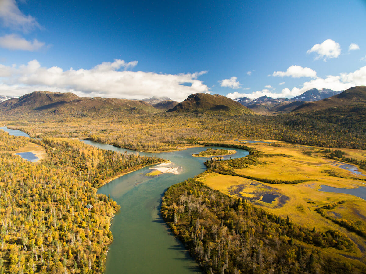 Areal view of river running through wooded mountains