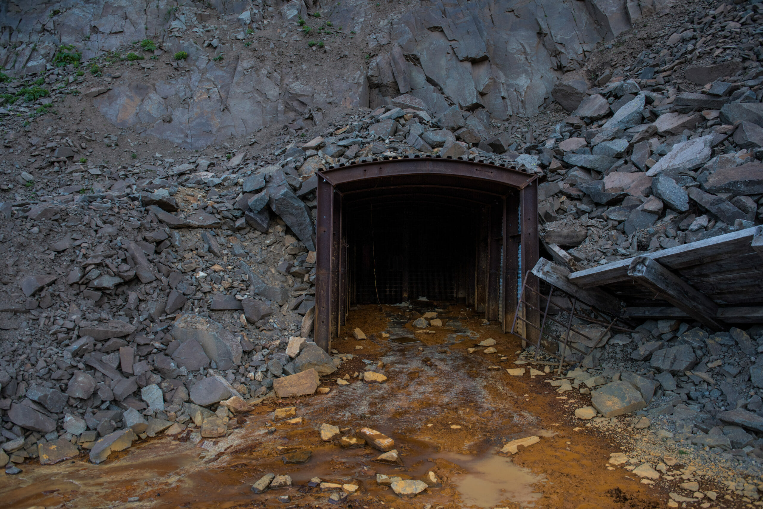 Mine entrance with polluted water coming out of it