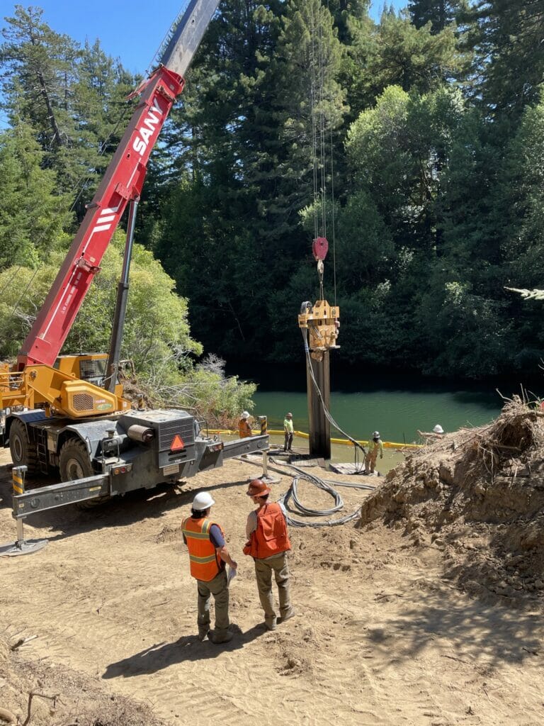 A crane working next to a river