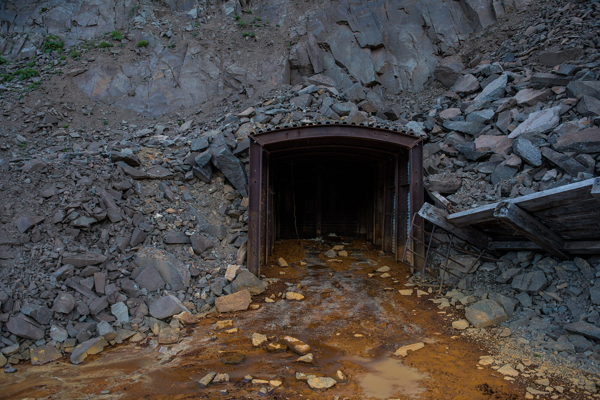 Discolored water coming out of a mine opening