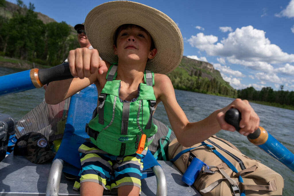 Boy rowing a boat