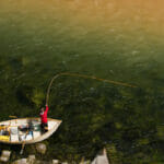 Birds eye view of man casting from a boat