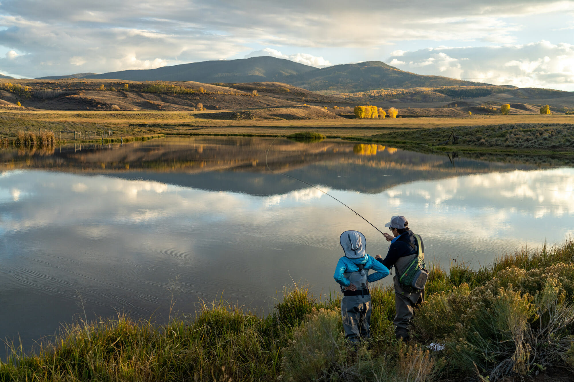 Two people fishing on a lake