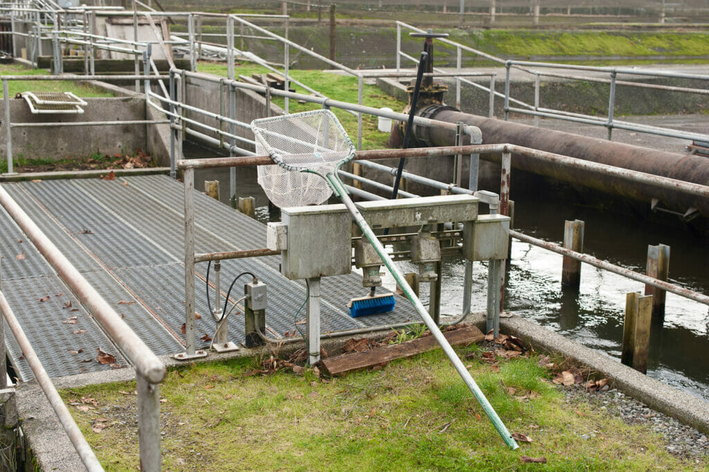 A net leaning against hatchery equipment