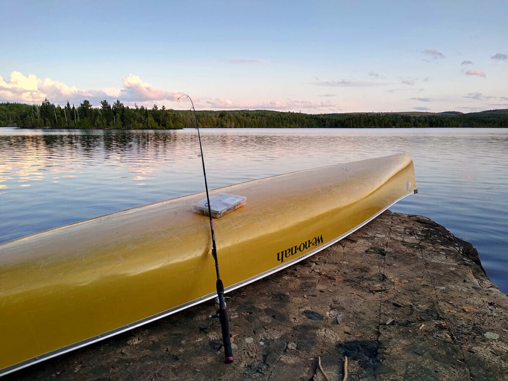 America's most visited wilderness provides respite along with incredible fishing. canoe on edge of beautiful boundary waters