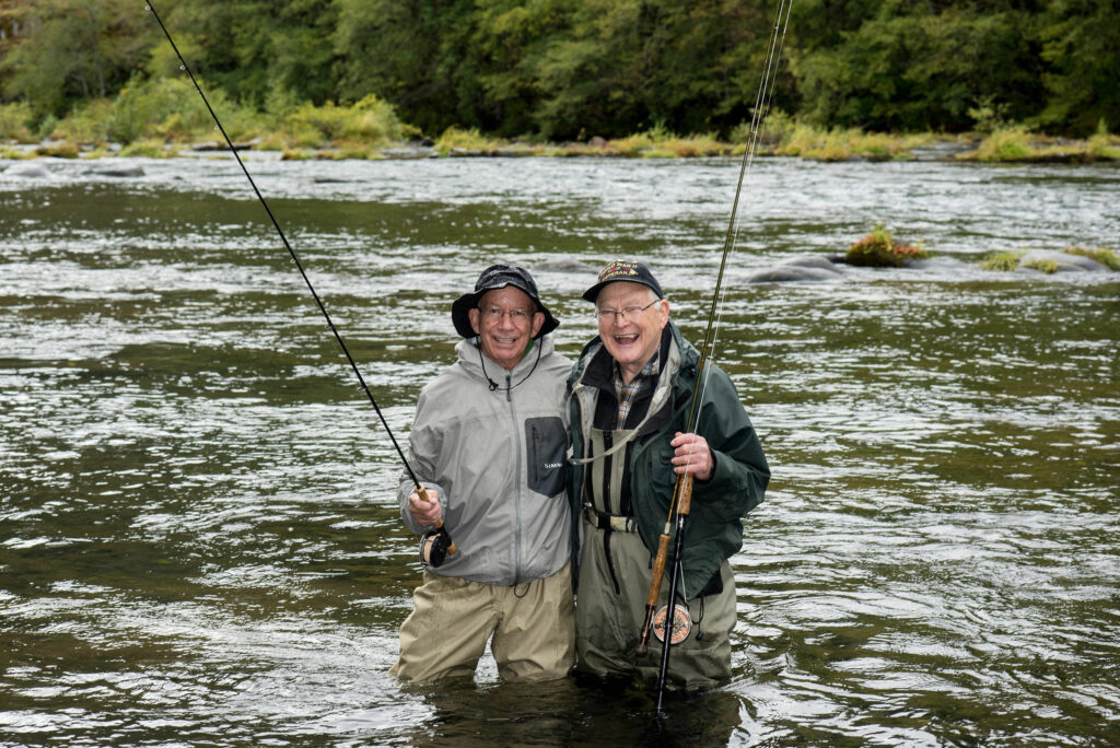 two fly fishing friends on the river