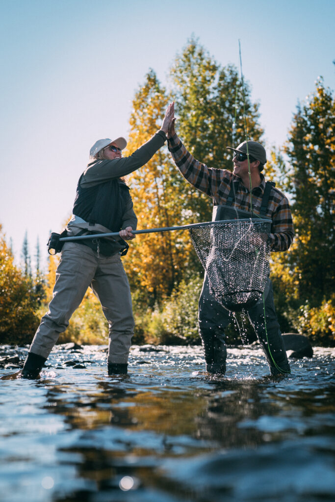 FlyLords Photo, fly fishing friends high fiving