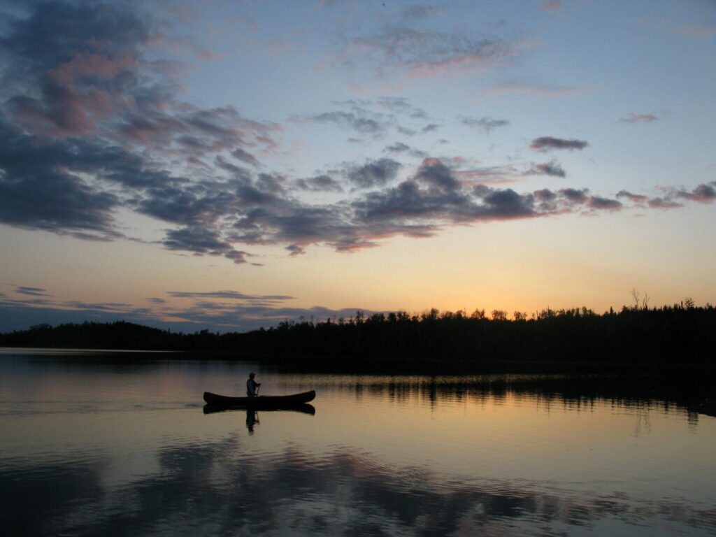 canoe on pristine boundary waters at sunset