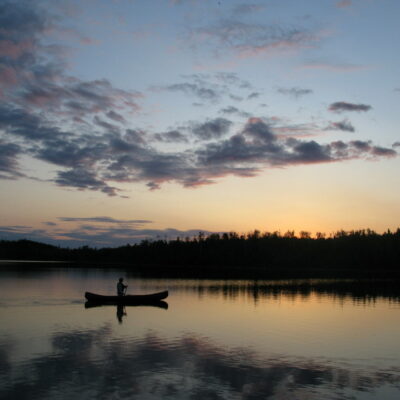 canoe on pristine boundary waters at sunset