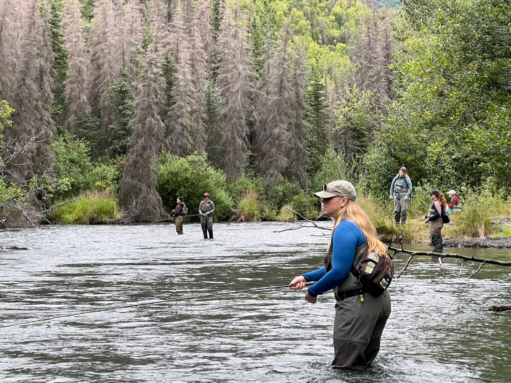 Women support each other in some great fishing holes at WoW in 2025. 