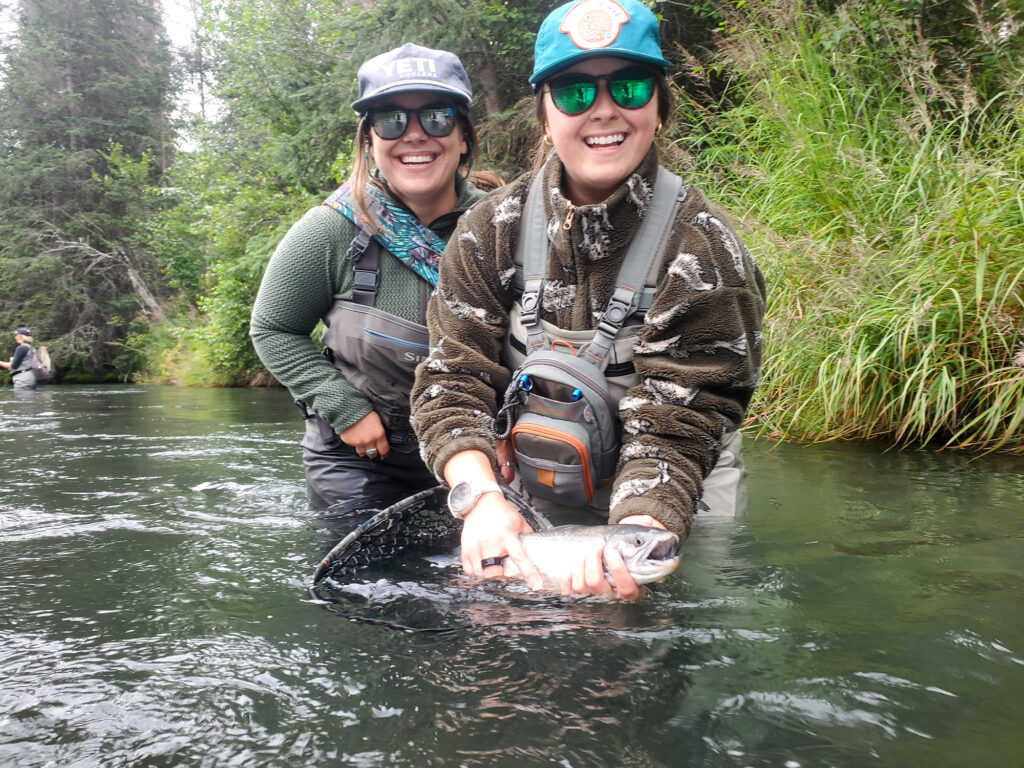 A couple of ladies share a special moment on the water in 2025. 