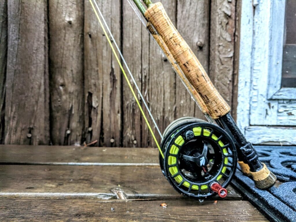 close up of fly rod leaning against wall