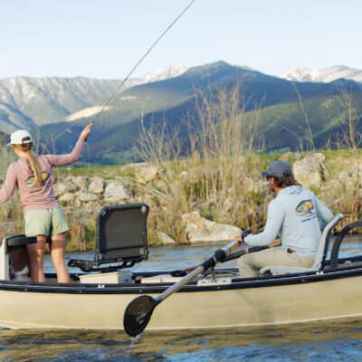 two anglers fishing in boat wearing free fly tu collab limited edition yellowstone cutthroat hoodie