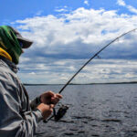 angler looking out over lake