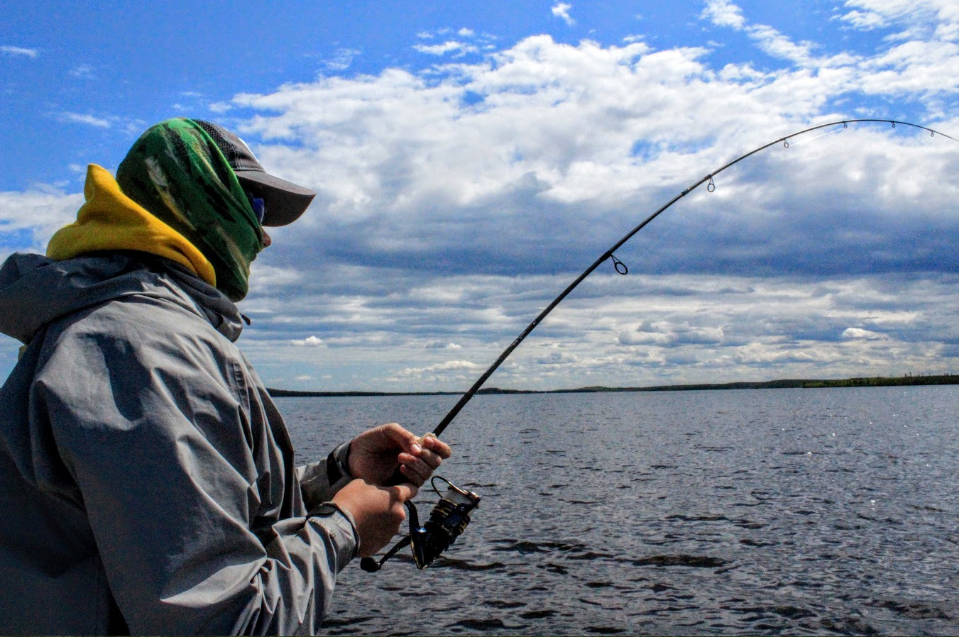 angler looking out over lake