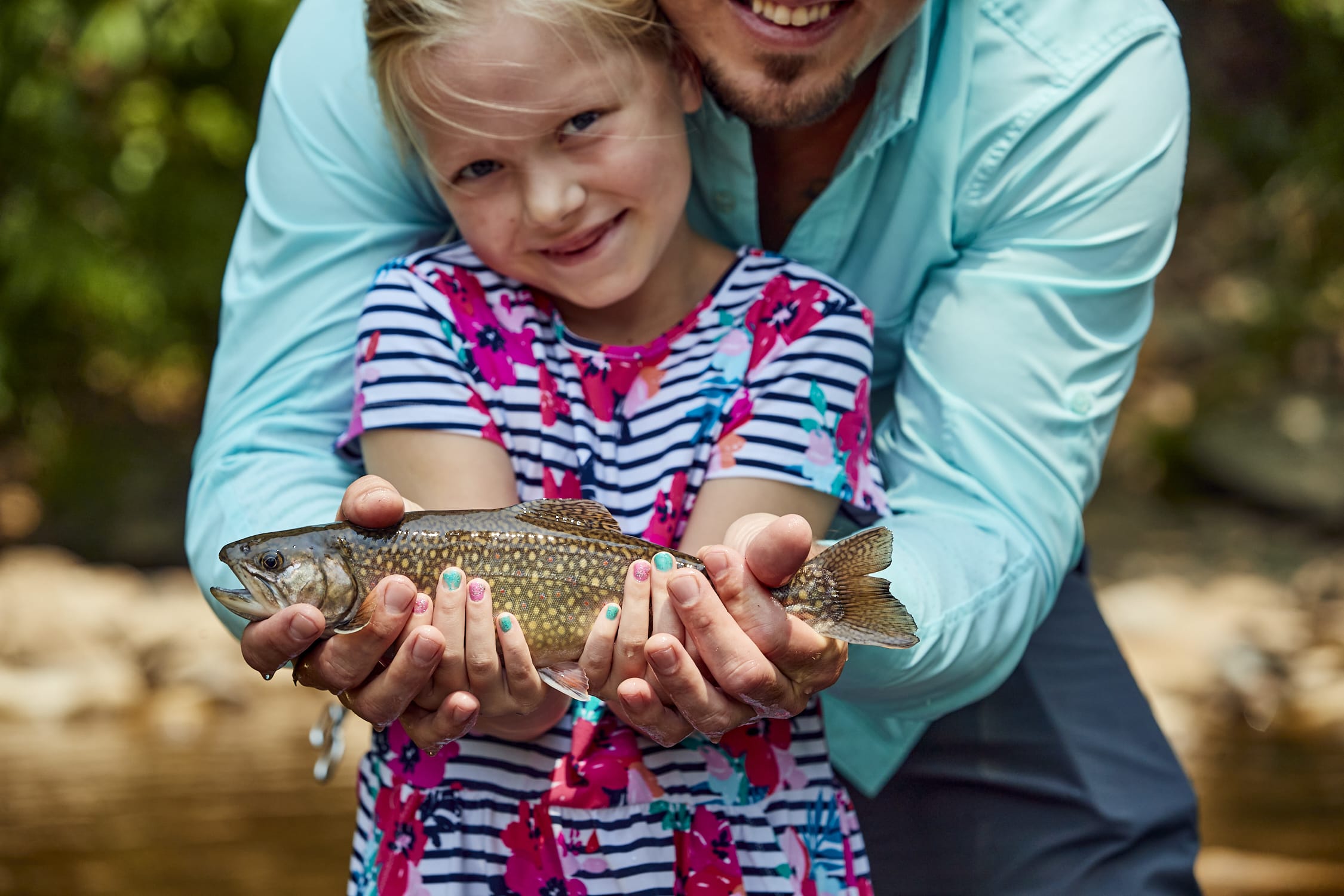 close up of Young girl holding fish