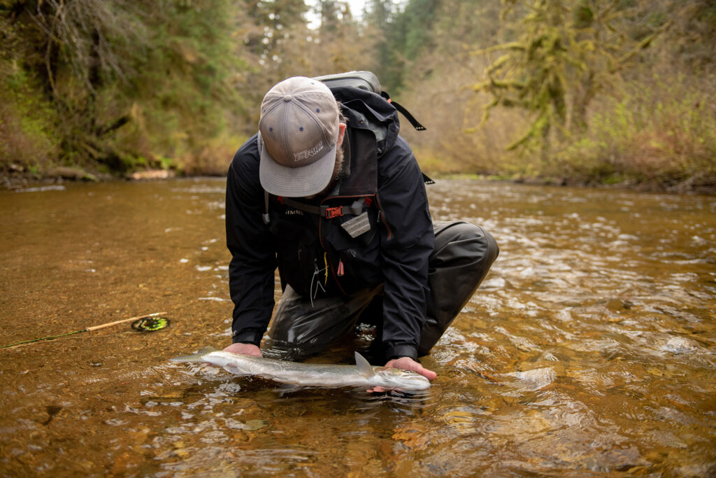 angler on Sitkoh River with steelhead